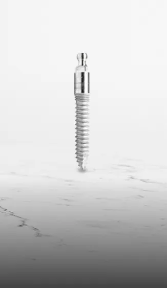 Close-up image of a mini dental implant, showcasing its small size and design for patients with minimal bone density