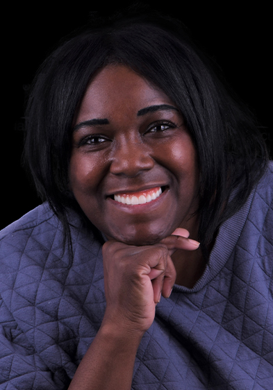 young black female patient smiling with her snap-on-dentures 