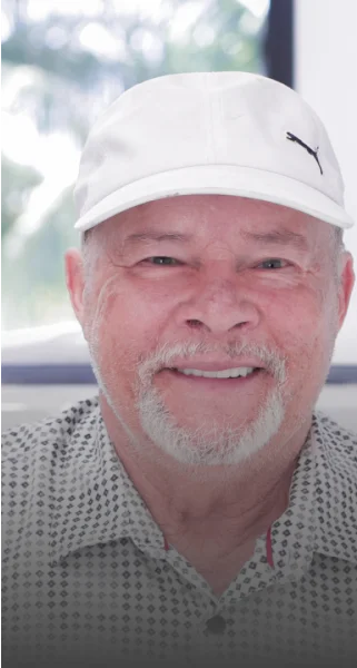 Smiling patient after getting his dental implants in a dental vacation in Cancun
